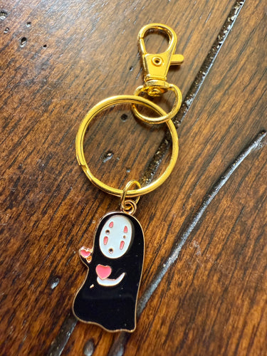No face purse charm