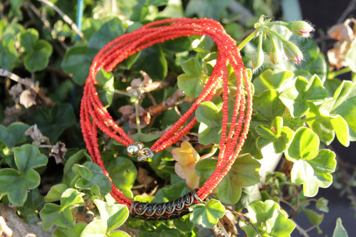 red-orange long necklace