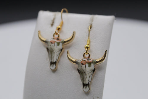Orange flower cow earrings